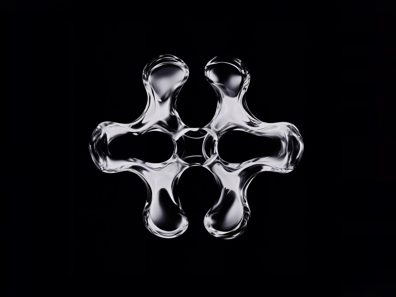 Abstract glass sculpture on a black background